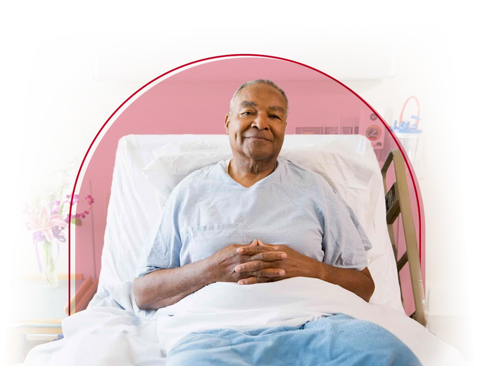 Man in a hospital bed.