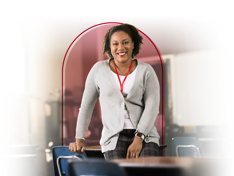 Female teacher posing in her classroom.