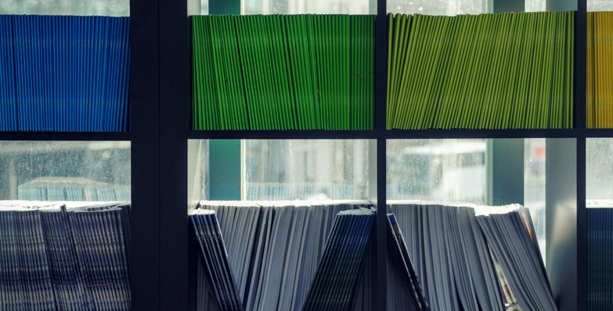 Lots of reports on a shelf.