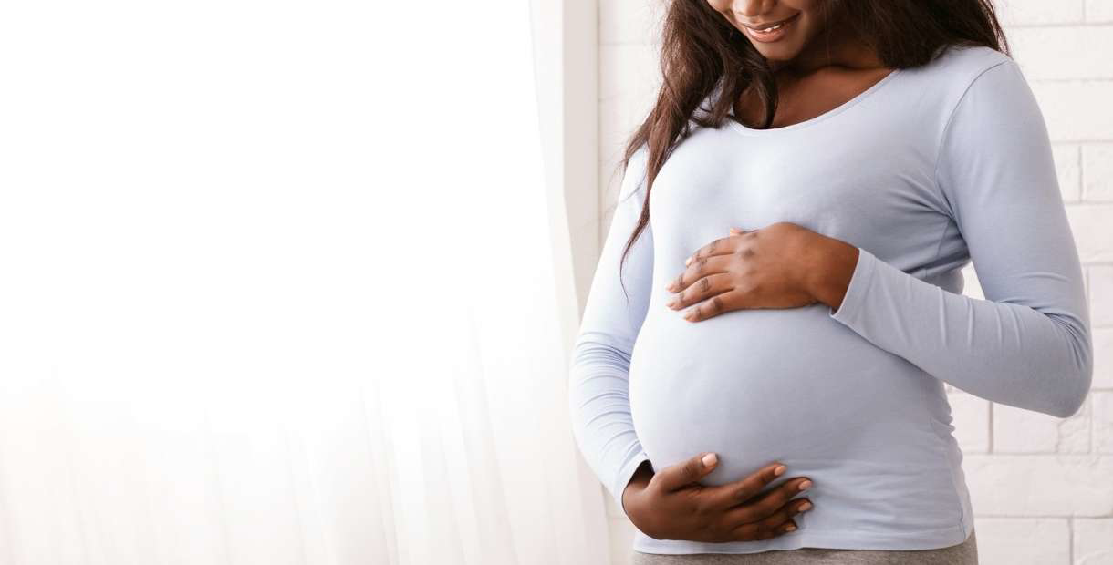 Woman holding her belly. 