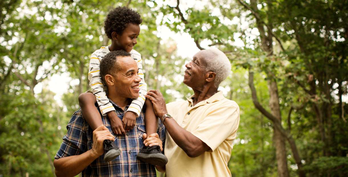 Three generations hanging out in the forest.