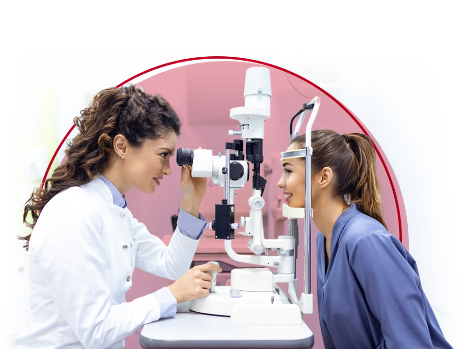 A doctor looking at a patient's eyes.