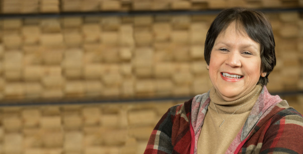 Cheryl, smiling at the camera.