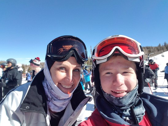 Christen and her son skiing