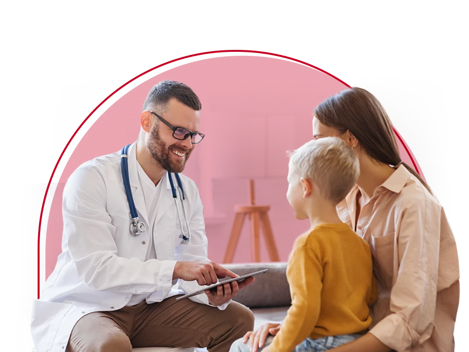 Doctor working with a young boy and his mother.