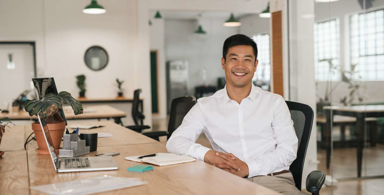 A person sitting at a desk in an office.