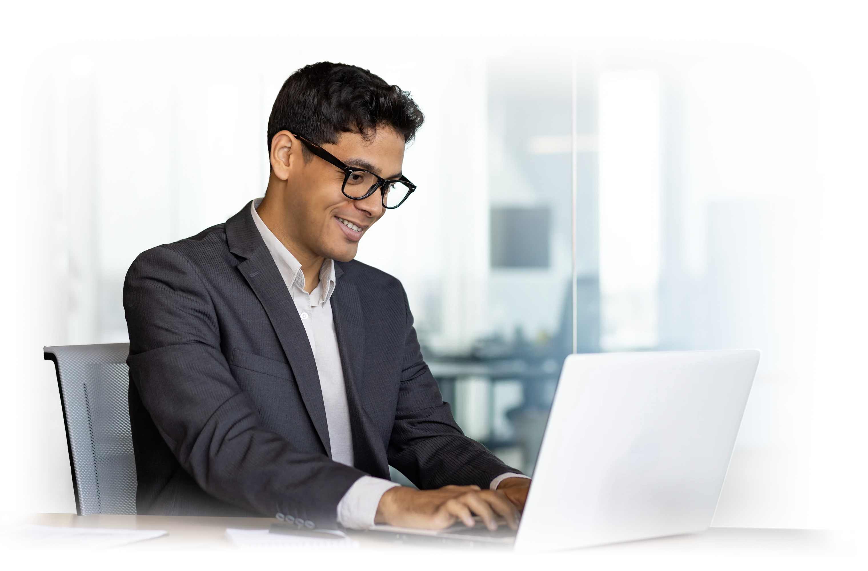 Business official typing on his laptop.