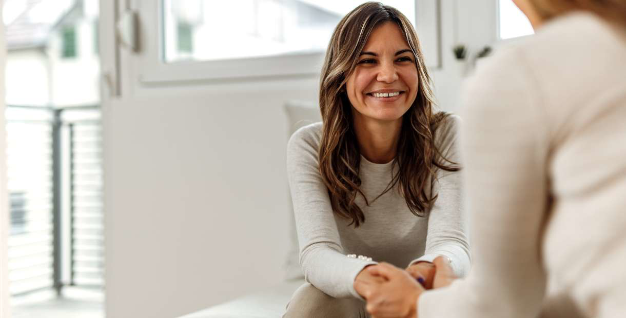 Mental health counselor talking with a patient.
