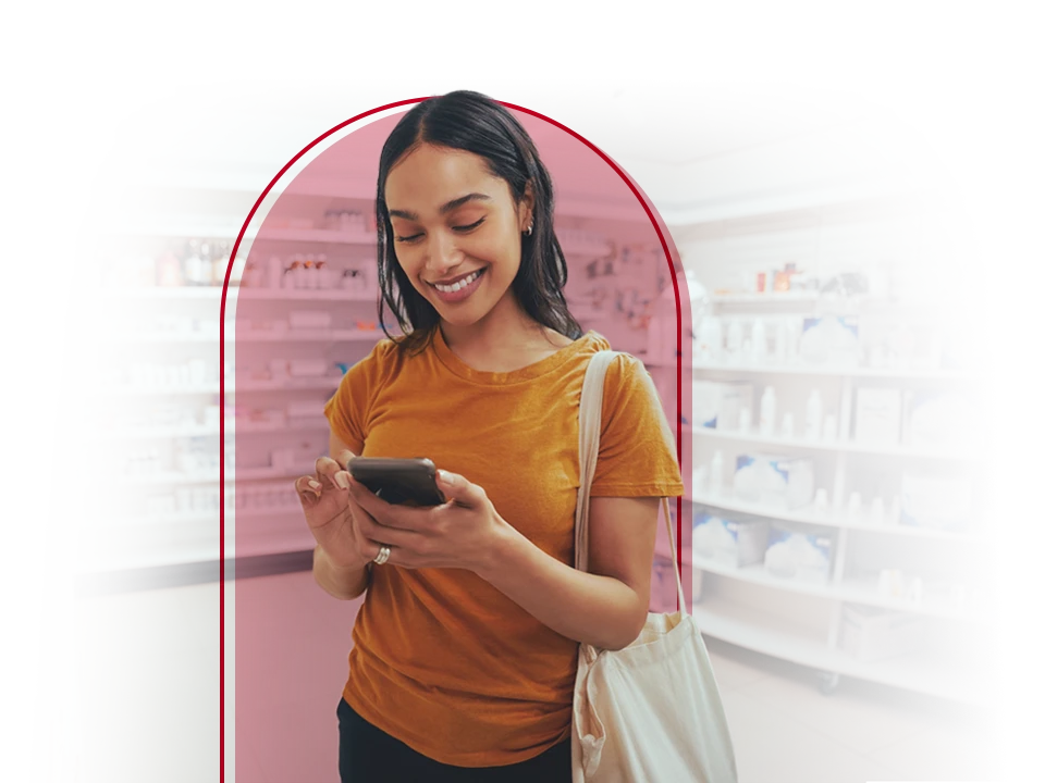 Woman smiling down at phone.