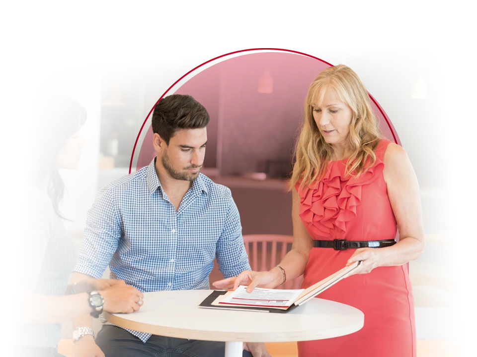 Female representative goes over benefits with male employee.