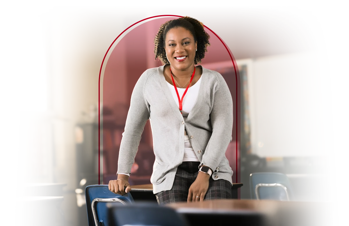 Female teacher posing in her classroom.